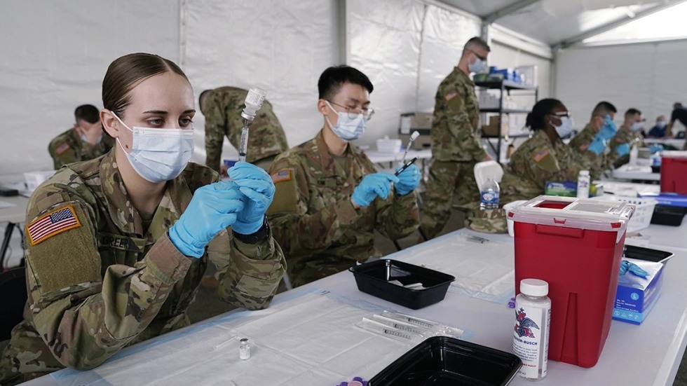 Soldiers administering vaccines