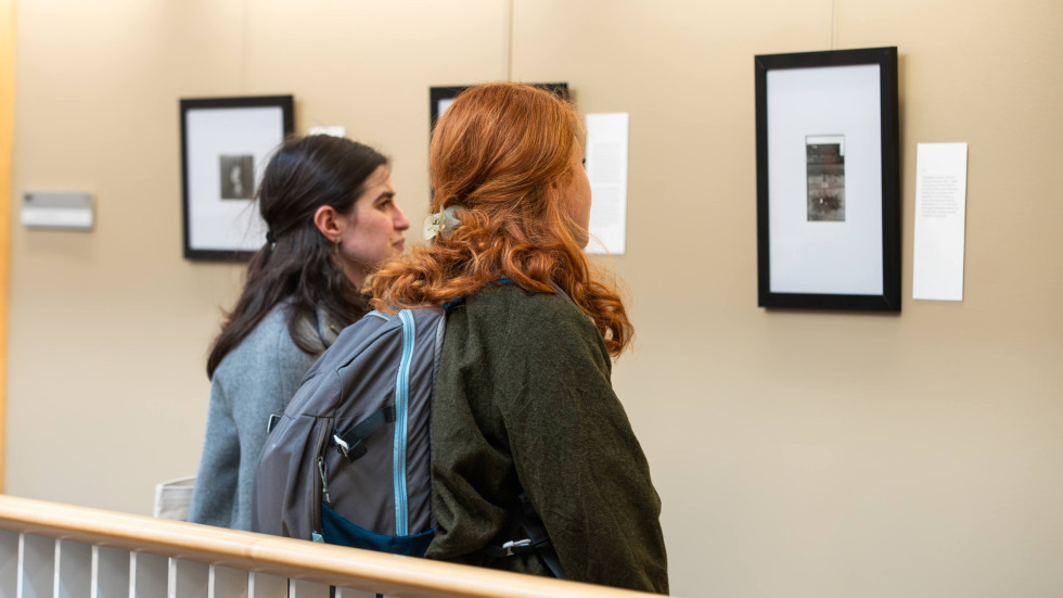 Two people viewing exhibition